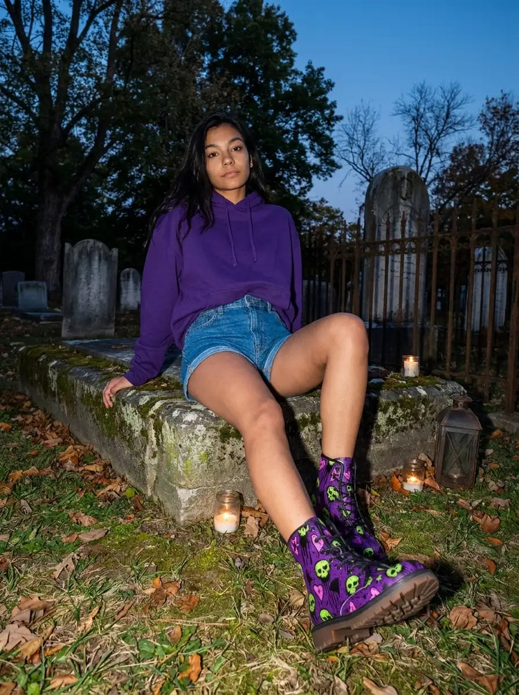 Purple and neon green skull-patterned combat boots.